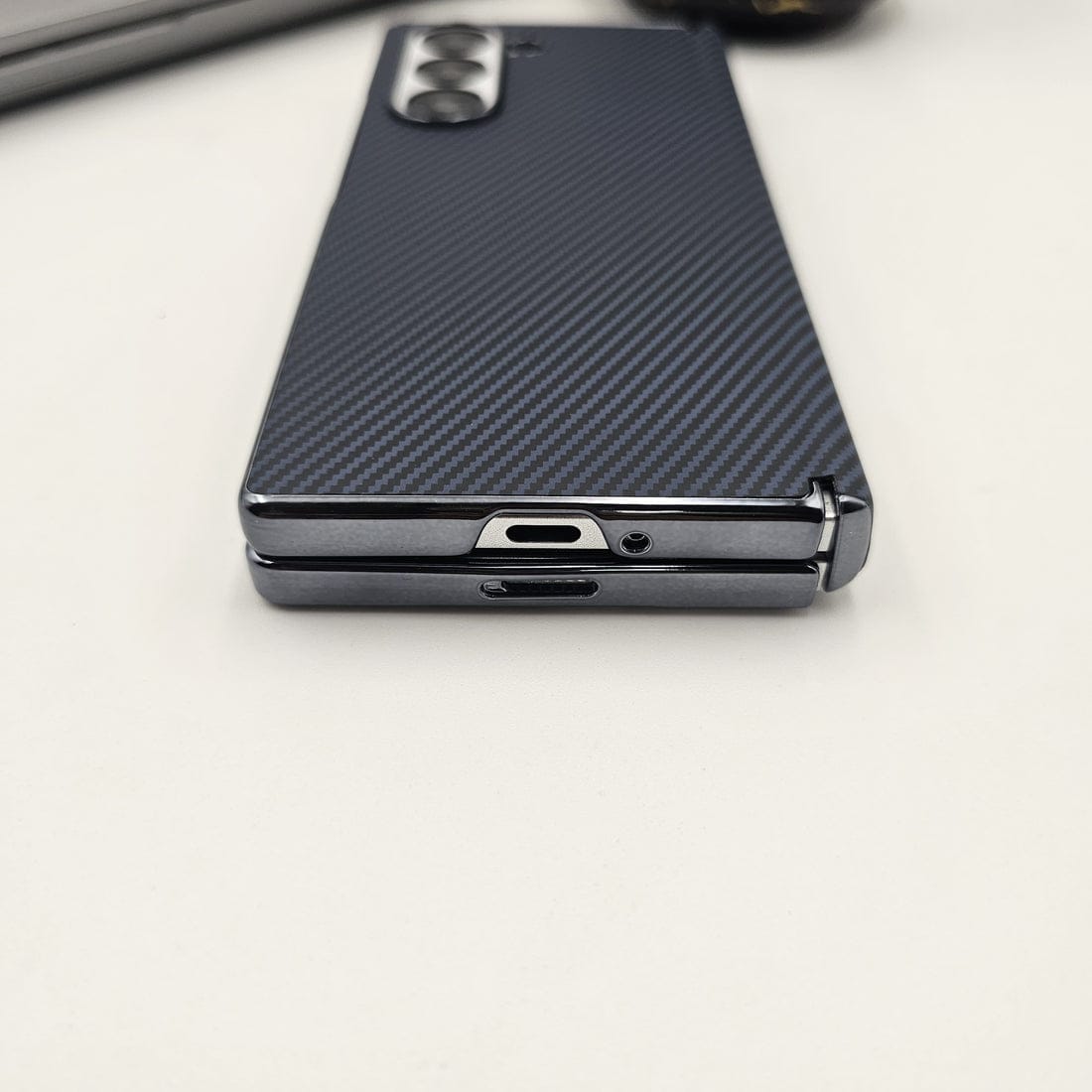 Phone case with carbon fiber texture on a white background