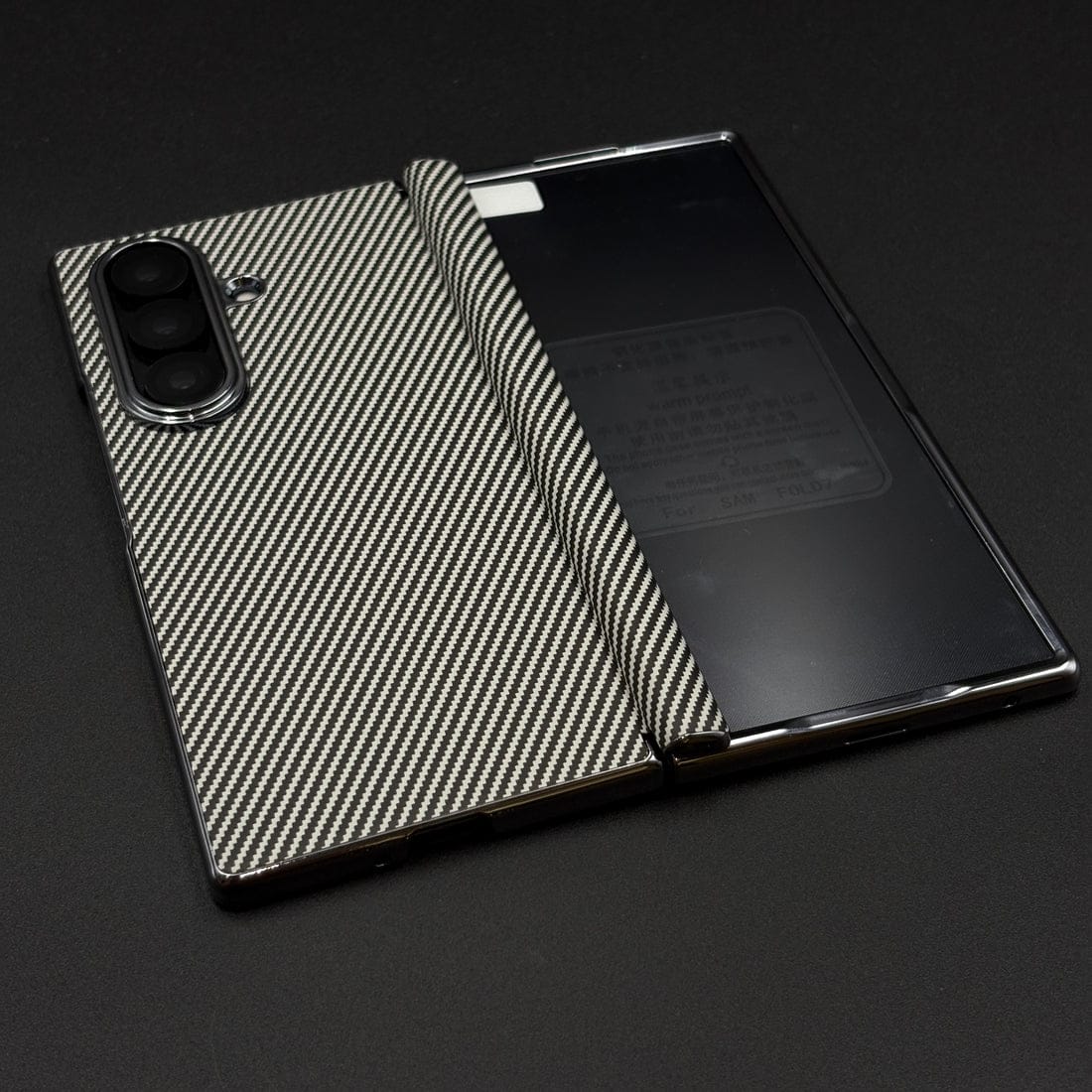 Phone case with carbon fiber pattern on a black background