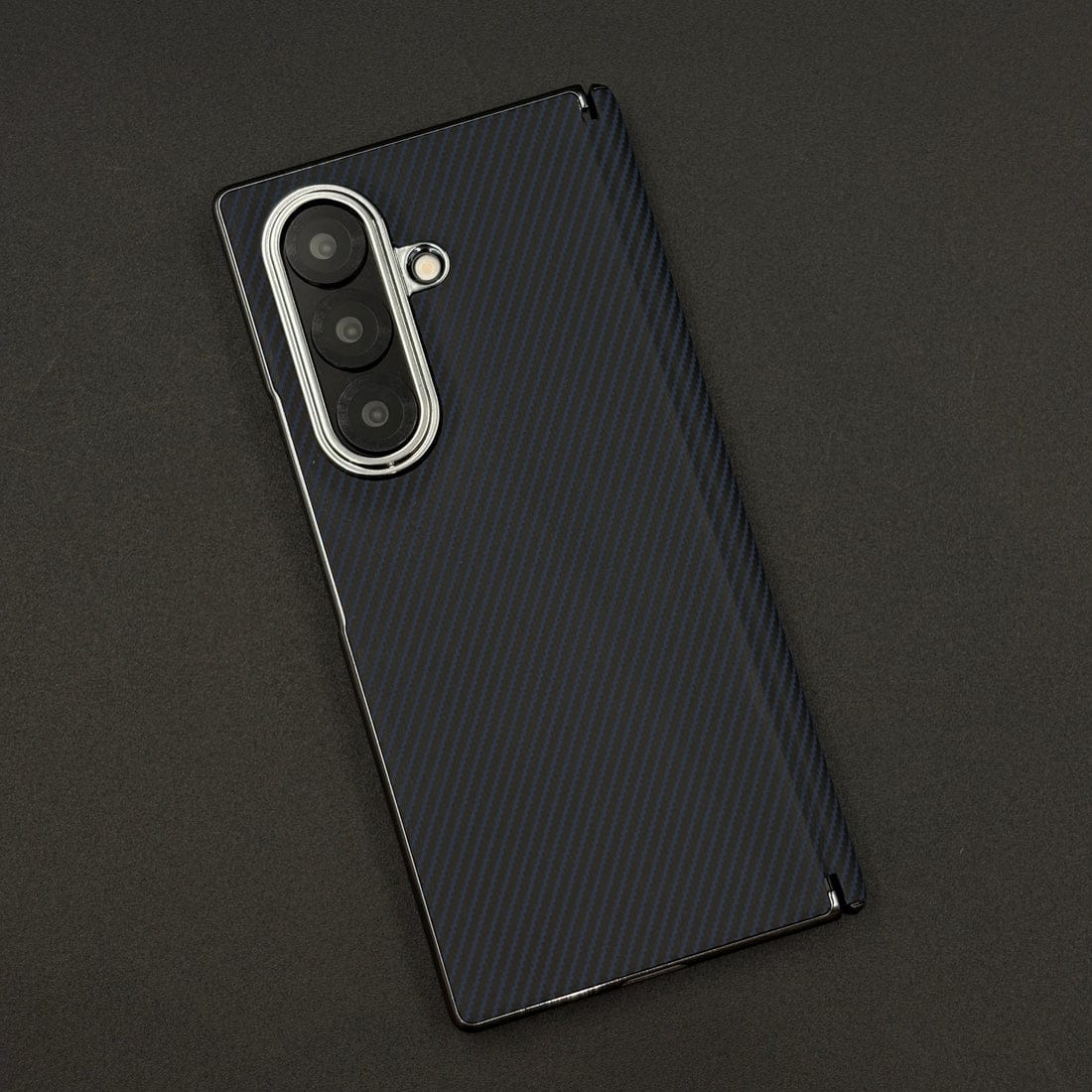 Black textured phone case on a dark background