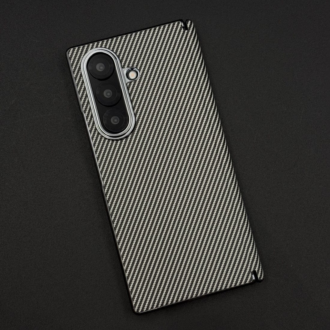 Phone case with carbon fiber pattern on a black background